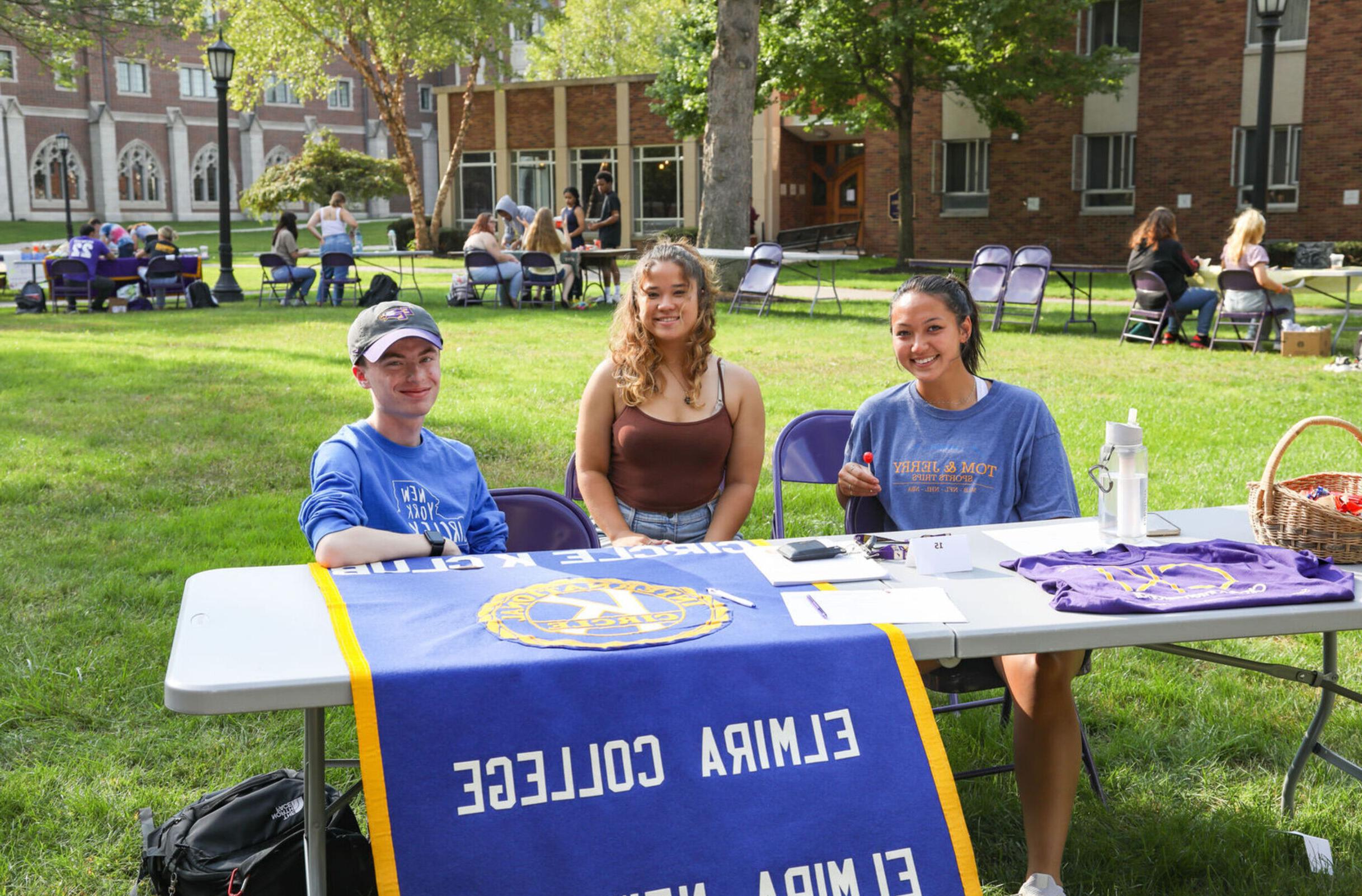 Members of Circle K sit at a table during the Engagement Fair 